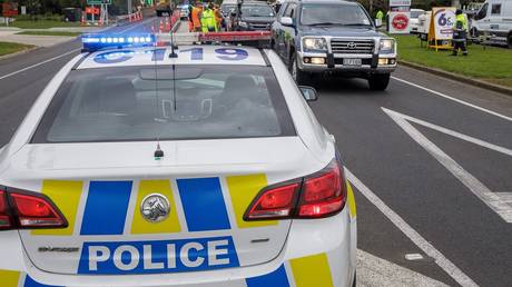 Police at a coronavirus checkpoint in Auckland, New Zealand