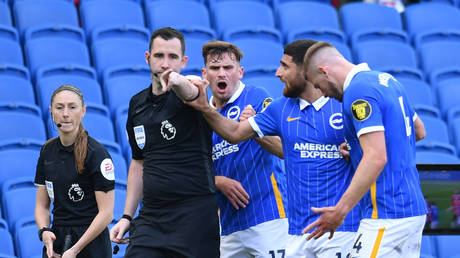 Brighton players at the late penalty award in their game with Manchester United. © Reuters