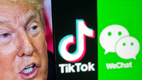 A picture of US President Donald Trump is seen on a smartphone in front of displayed TikTok and WeChat logos in this illustration taken September 18, 2020. © Reuters / Dado Ruvic / Illustration