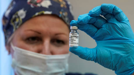 FILE PHOTO: A nurse shows Russia's "Sputnik-V" vaccine against the coronavirus disease (COVID-19) prepared for inoculation in a post-registration trials stage at a clinic in Moscow, Russia September 17, 2020.