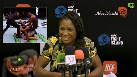 Angela Hill said she saw nothing wrong with Israel Adesanya's celebrations against Paulo Costa. © RT Sport / Twitter (inset)