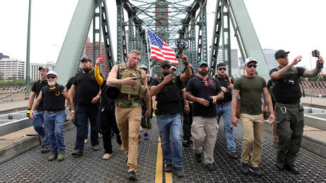 Proud Boys members march during an Aug. 16 demonstration in Portland.