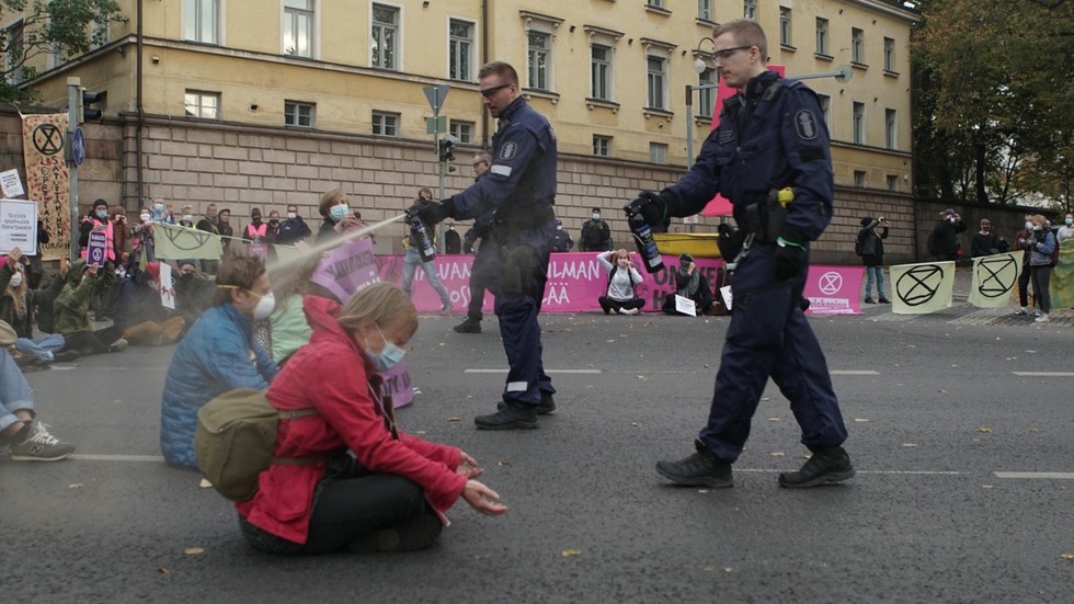 'Shame on you Finland! How dare you!' Outrage as Helsinki police PEPPER SPRAY sitting XR protesters