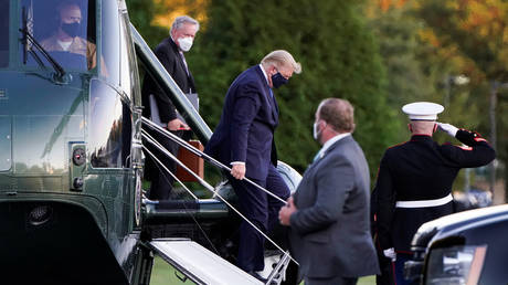 US President Donald Trump disembarks from the Marine One at Walter Reed National Military Medical Center in Bethesda, Maryland, US, October 2, 2020