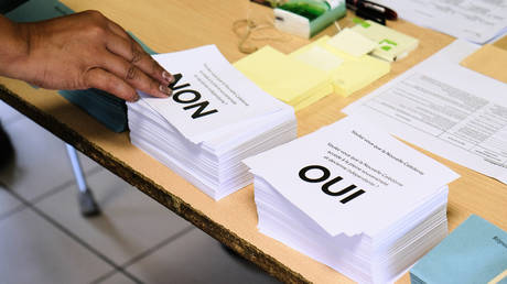 A person casts a vote in Noumea, New Caledonia on October 4, 2020.