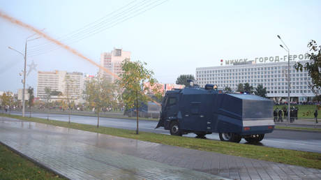 FILE PHOTO: Belarusian law enforcement members use a water cannon to disperse a crowd during a protest. © Reuters / Tut.By