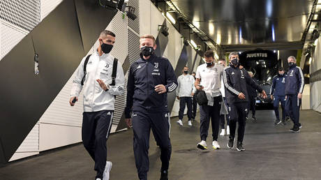 Cristiano Ronaldo and Roberto Baronio arrive for Juventus' ill-fated game against Napoli. © Getty Images