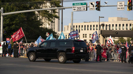 US President Trump's motorcade drives by supporters outside of Walter Reed Medical Center in Bethesda, Maryland, October 4, 2020