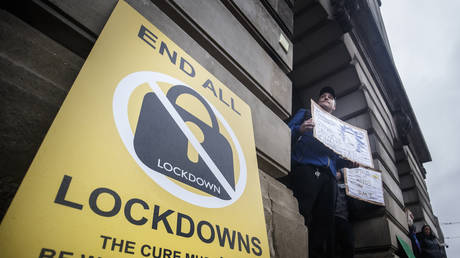 A poster at an anti-lockdown protest in Old Market Square, Nottingham, after a range of new restrictions to combat the rise in coronavirus cases came into place in England