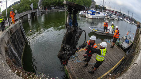 The statue of slave trader Edward Colston is retrieved from Bristol Harbour by a salvage team on June 11, 2020 in Bristol, England