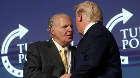 U.S. President Donald Trump greets Rush Limbaugh before delivering remarks at the Turning Point USA Student Action Summit in West Palm Beach, Florida, U.S. December 21, 2019. © REUTERS/Leah Millis