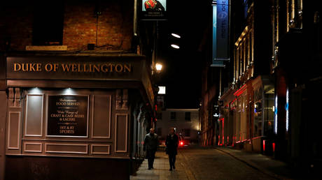 FILE PHOTO: People walk past the bar in the city center, as the coronavirus disease (COVID-19) outbreak continues, in Newcastle, Britain September 2020