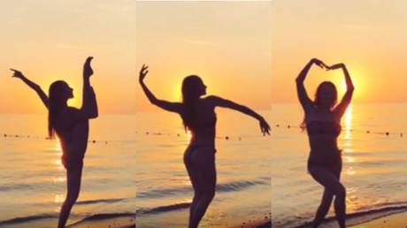 Swaying in the sunset: Russian synchronized swimming beauty Vlada Chigireva delights fans with bikini dance (VIDEO)