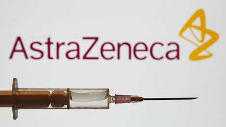FILE PHOTO: Medical syringe is seen with AstraZeneca company logo displayed on a screen in the background in this illustration photo taken in Poland on June 16, 2020.