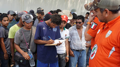 FILE PHOTO. Migrants from Central America waiting to board a freight train to continue their journey towards the United States, April 30, 2019.