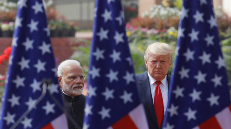 FILE PHOTO: U.S. President Donald Trump and India's Prime Minister Narendra Modi arrive for their joint news conference at Hyderabad House in New Delhi, India, February 25, 2020