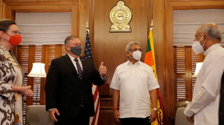 U.S. Secretary of State Mike Pompeo greets the gathering before his meeting with Sri Lankan President Gotabaya Rajapaksa in Colombo, Sri Lanka, Wednesday, Oct. 28, 2020