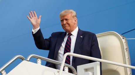 U.S. President Donald Trump waves from Air Force One as he arrives to attend a town hall campaign event in Philadelphia, Pennsylvania,