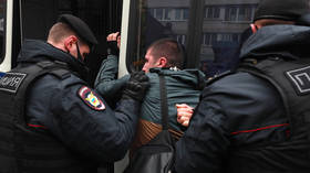 Photos of Macron set alight & arrests made as Muslims protest over Prophet Mohammed cartoons outside French embassy in Moscow