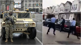 Philadelphia mayor orders curfew but DELAYS release of shooting footage as National Guard troops arrive to help quell unrest