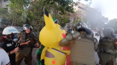 WATCH Chilean cops tackle and pepper-spray protester in Pikachu costume during demonstration in Santiago