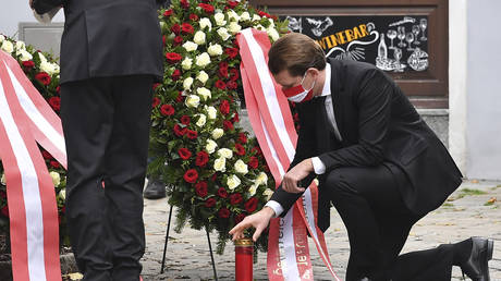 Austrian Chancellor Sebastian Kurz places a candle at scene of terrorist attack in Vienna on November 3, 2020. © AFP / Joe Klamar