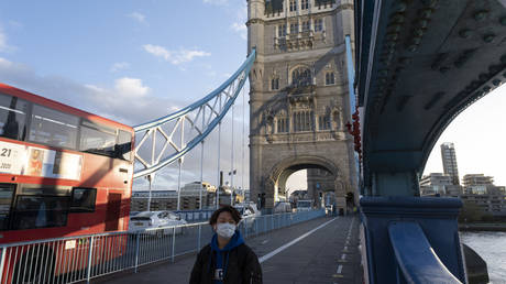 As Londoners await the second coronavirus national lockdown people still come to visit the sights such as Tower Bridge, some wearing face masks and some not, on what will be the last few days of normality before a month-long total lockdown in the UK on 2nd November 2020 in London, United Kingdom.
