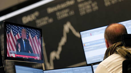 U.S. President Donald Trump is seen on a TV screen as the German share price index DAX reacts to the 2020 U.S. presidential election at the stock exchange in Frankfurt, Germany, November 4, 2020