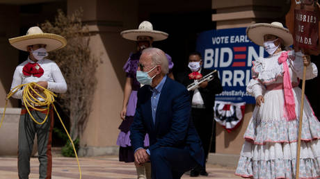 Democratic presidential candidate Joe Biden poses with supporters after speaking at the East Las Vegas Community Center about the effects of Covid-19 on Latinos, October 9, 2020, in Las Vegas, Nevada.
