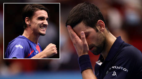 Tennis world number one Novak Djokovic (right) lost to Lorenzo Sonego (left) after the death of Serbian church leader Anfilohije Radovic © Lisi Niesner / Reuters