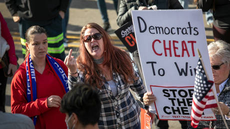 Trump supporters vent frustration at the media during a demonstration outside the TCF center on November 06, 2020 in Detroit, Michigan
