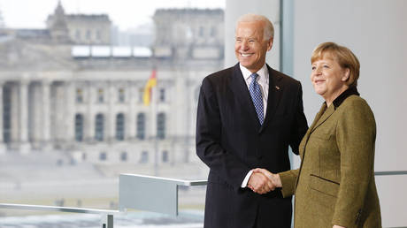 FILE PHOTO: Angela Merkel and Joe Biden shake hands before talks in Berlin, Germany, February 1, 2013 © Reuters / Tobias Schwarz