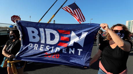 Supporters of Democratic US presidential nominee Joe Biden celebrate after news media declared Biden to be the winner of the election. © Reuters / Jim Bourg