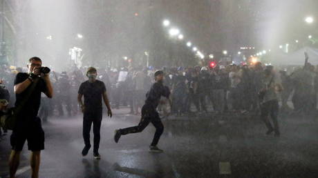Police use water cannon during a march to The Grand Palace in Bangkok, Thailand. © Reuters / Athit Perawongmetha