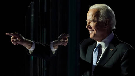 FILE PHOTO: President-elect Joe Biden points a finger at his election rally in Wilmington, Delaware, November 7