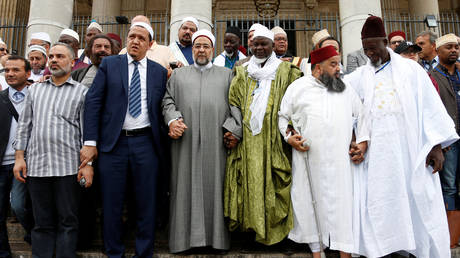 FILE PHOTO: Imams from various countries pose during a European commemorative tour to the sites of Islamist attacks, in Brussels, Belgium, on July 10, 2017.