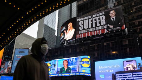 FILE PHOTO: Images of Ivanka Trump and Jared Kushner are seen alongside messages about coronavirus disease (COVID-19) infections and deaths on billboards sponsored by The Lincoln Project above Times Square in New York City, U.S. October 24, 2020.