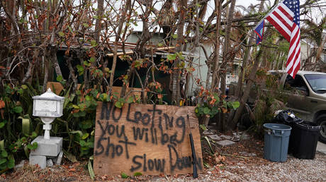 FILE PHOTO: A "No Looting" sign is pictured following Hurricane Irma in Big Pine Key, Florida, September 25, 2017