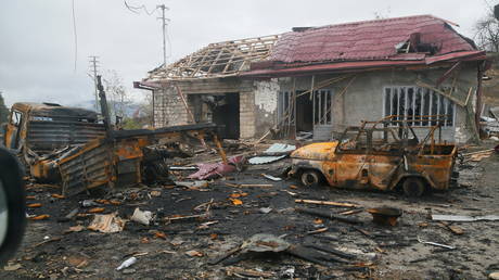 A view shows burnt vehicles and a damaged building on the outskirts of Shusha  in the region of Nagorno-Karabakh on November 13, 2020.