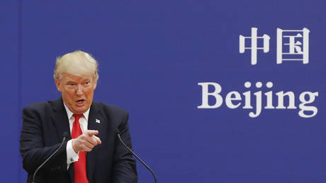 U.S. President Donald Trump and China's President Xi Jinping (not shown) speak to business leaders