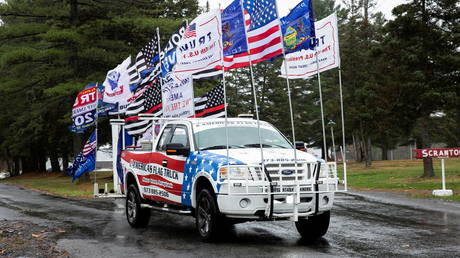 FILE PHOTO: A truck with flags attached is seen at a Bikers for Trump event in Scranton, Pennsylvania, November 1, 2020 © Reuters / Rachel Wisniewski