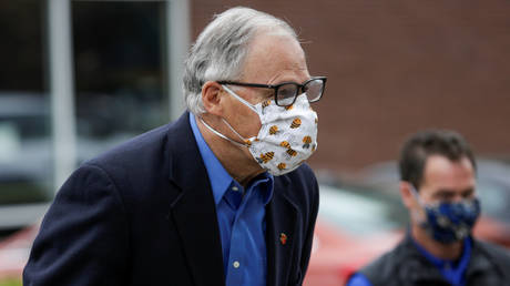 Washington Governor Jay Inslee is shown arriving at a Covid-19 training event in May.