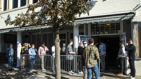 People wait in line to get into a bar before the Hawkeyes NCAA Big Ten Conference football home opener against Northwestern in Iowa City, Iowa , Saturday, Oct. 31  © Reuters/USA TODAY NETWORK/ Joseph Cress