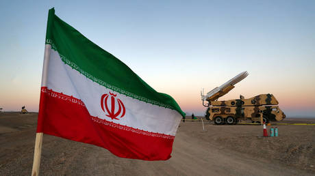 FILE PHOTO: An Iranian flag is pictured near in a missile during a military drill, Iran. © West Asia News Agency via REUTERS