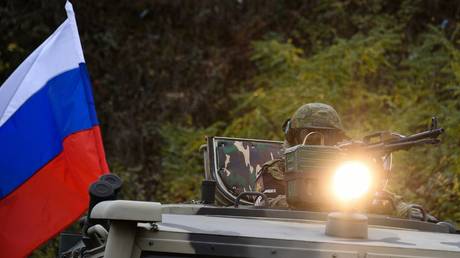 Russian peacekeepers accompany an Azerbaijani military convoy from Shusha towards the village of Krasny Bazar.