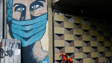 A mural promoting wearing of masks in Jakarta, Indonesia, October 2, 2020.