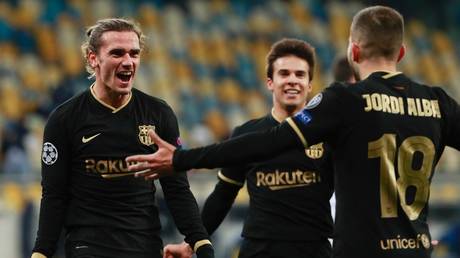 Antoine Griezmann celebrates netting Barca's fourth goal in their 4-1 Champions League win in Kiev