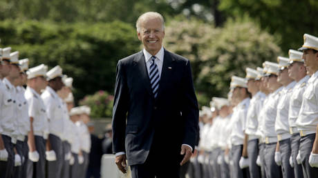 FILE PHOTO: U.S. Vice President Joe Biden makes his way down a row of cadets as he arrives to address to graduates of The United States Military Academy at West Point May 26, 2012 in West Point, New York.