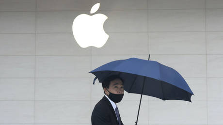 Better get a second umbrella for your iPhone... © Reuters / Ann Wang