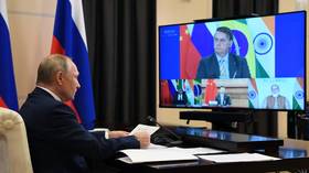 Putin uses BRICS summit to call for lifting of sanctions on poorer countries devastated by coronavirus pandemic